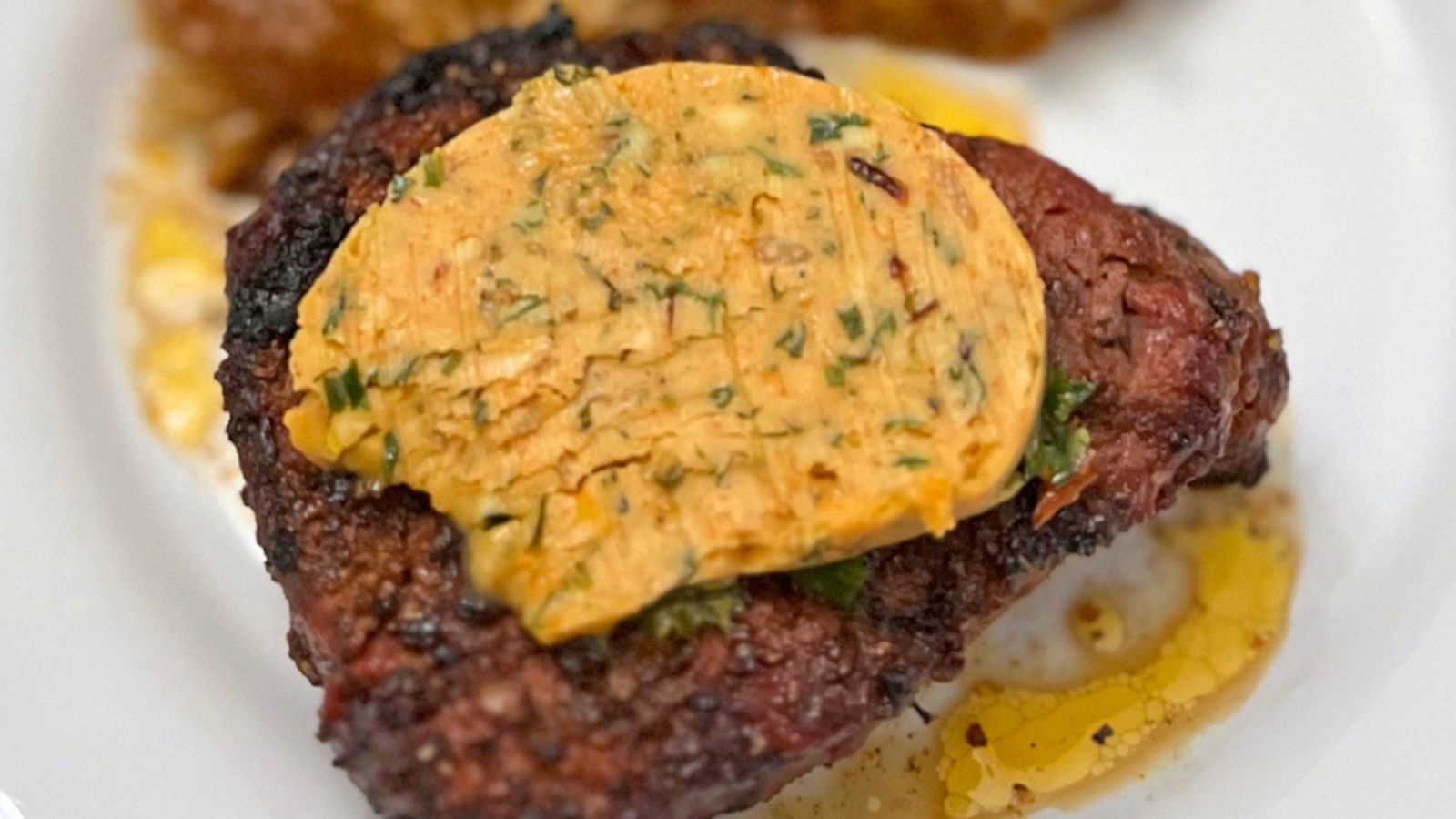 Steak with butter on top.