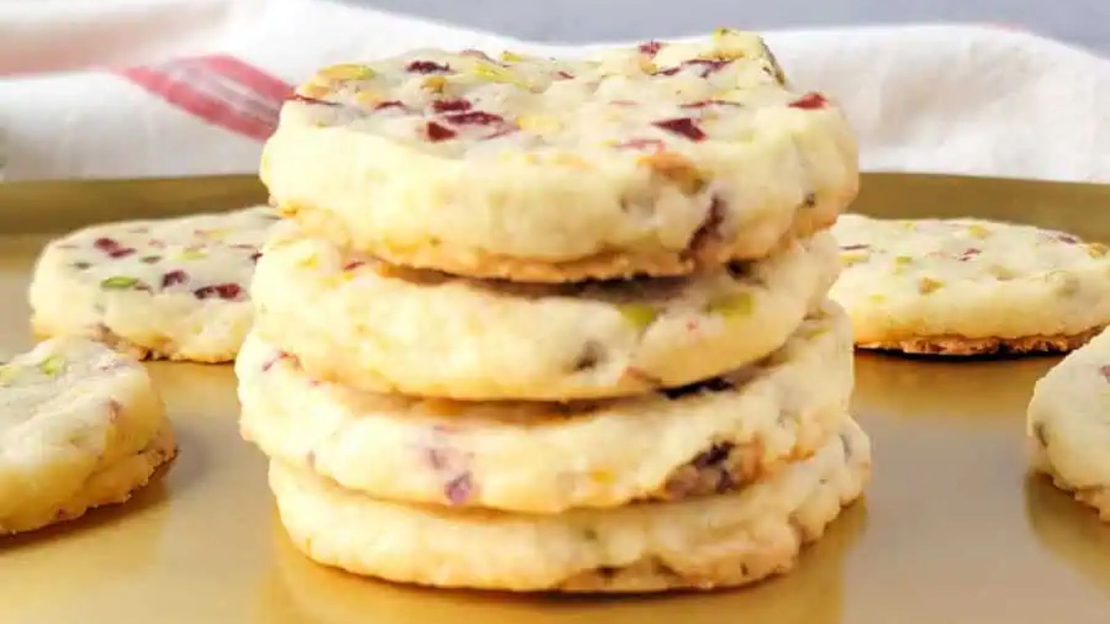 Stack of cookies with cranberries and pistachio.