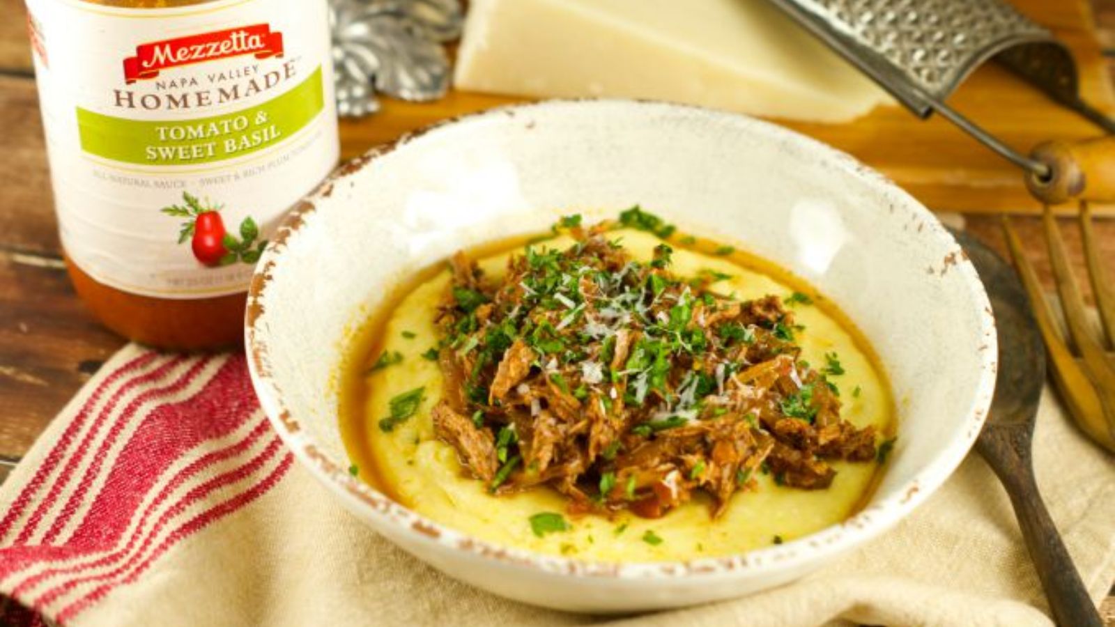 Beef ragu with polenta in a bowl.