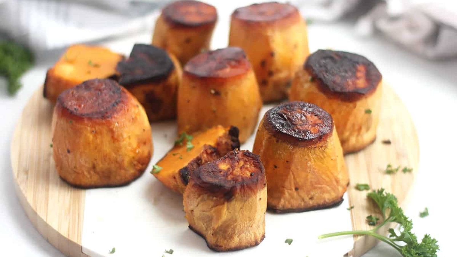 Fondant sweet potatoes on a plate.