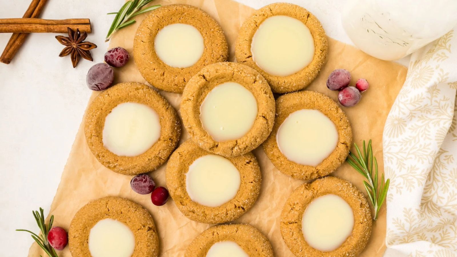 Thumbprint cookies on a wooden board.