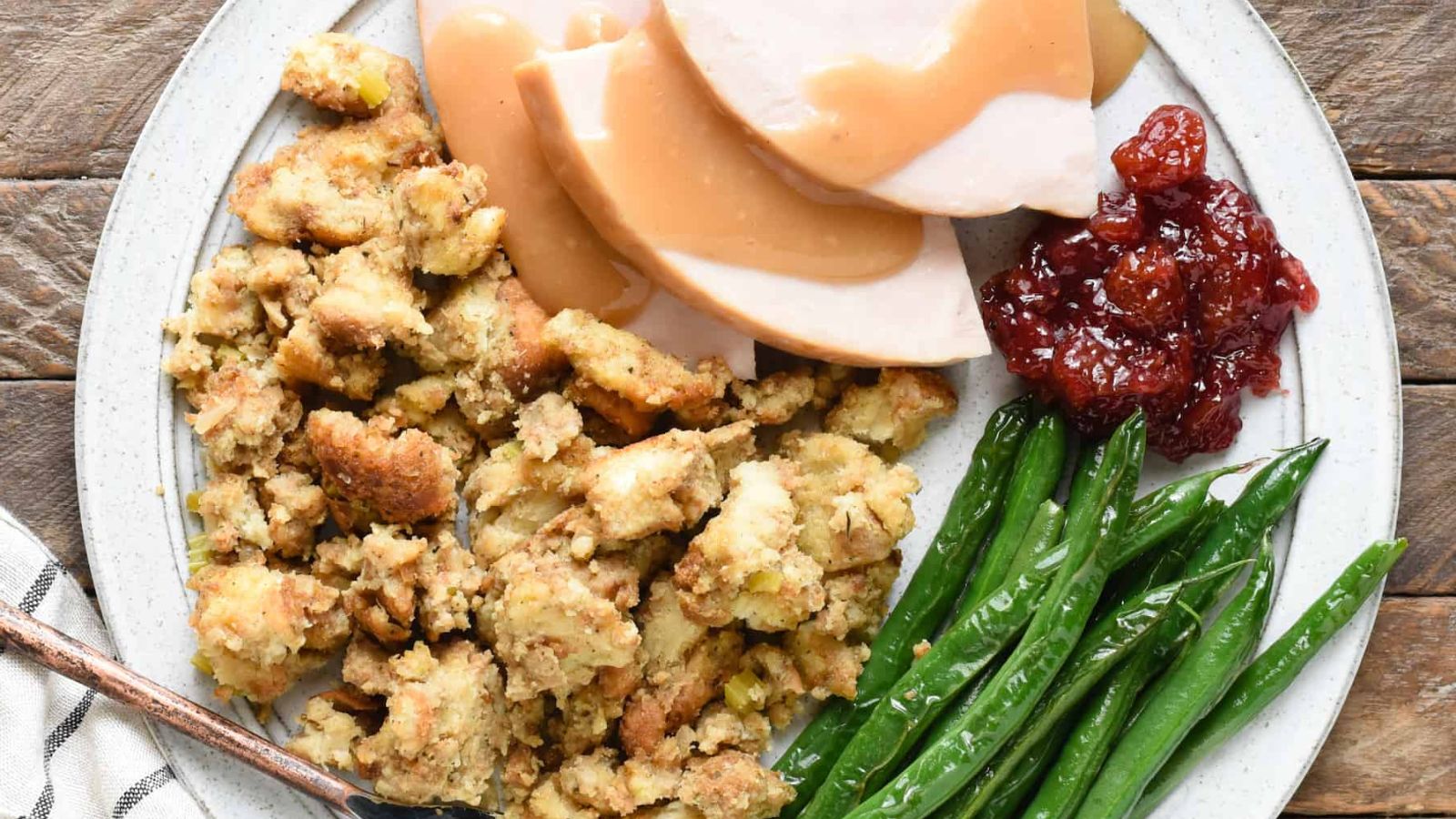 Bread stuffing with green beans on the side.