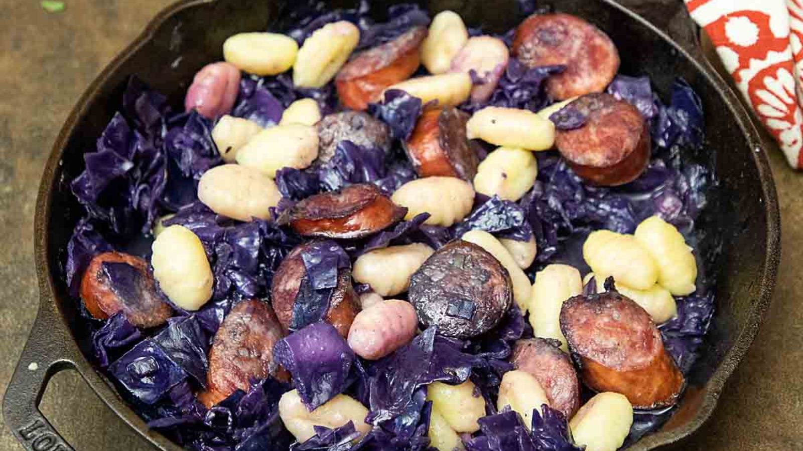 Kielbasa and cabbage in pan.