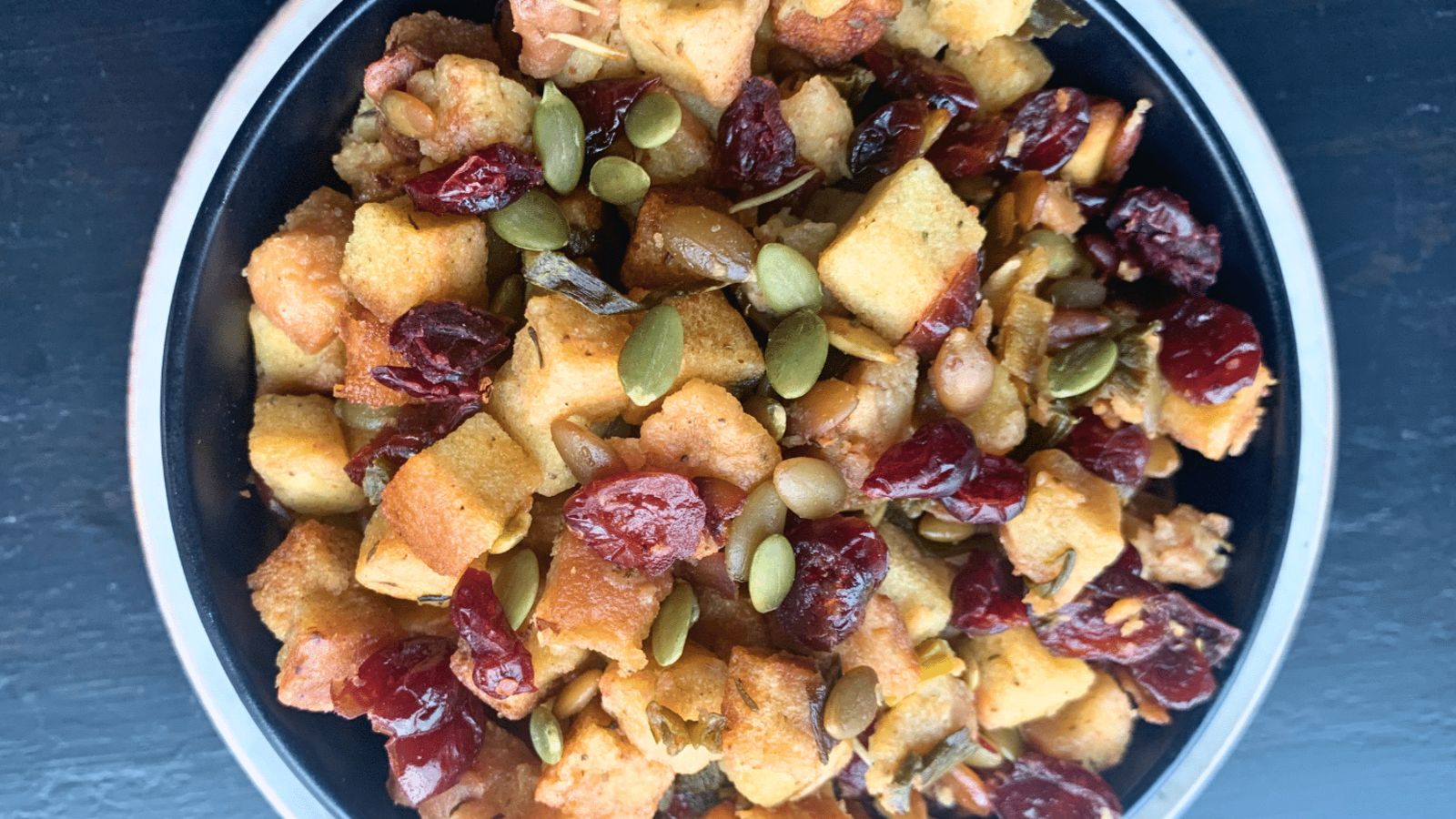 Cranberry pumpkin seed stuffing in a bowl.
