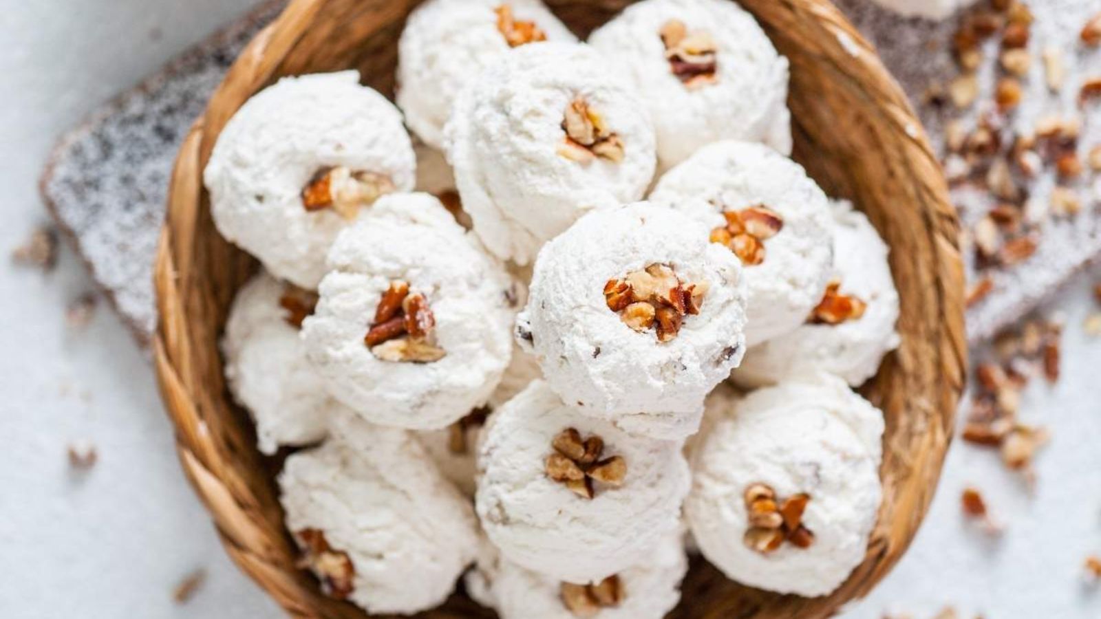 White candies with peanut on top.