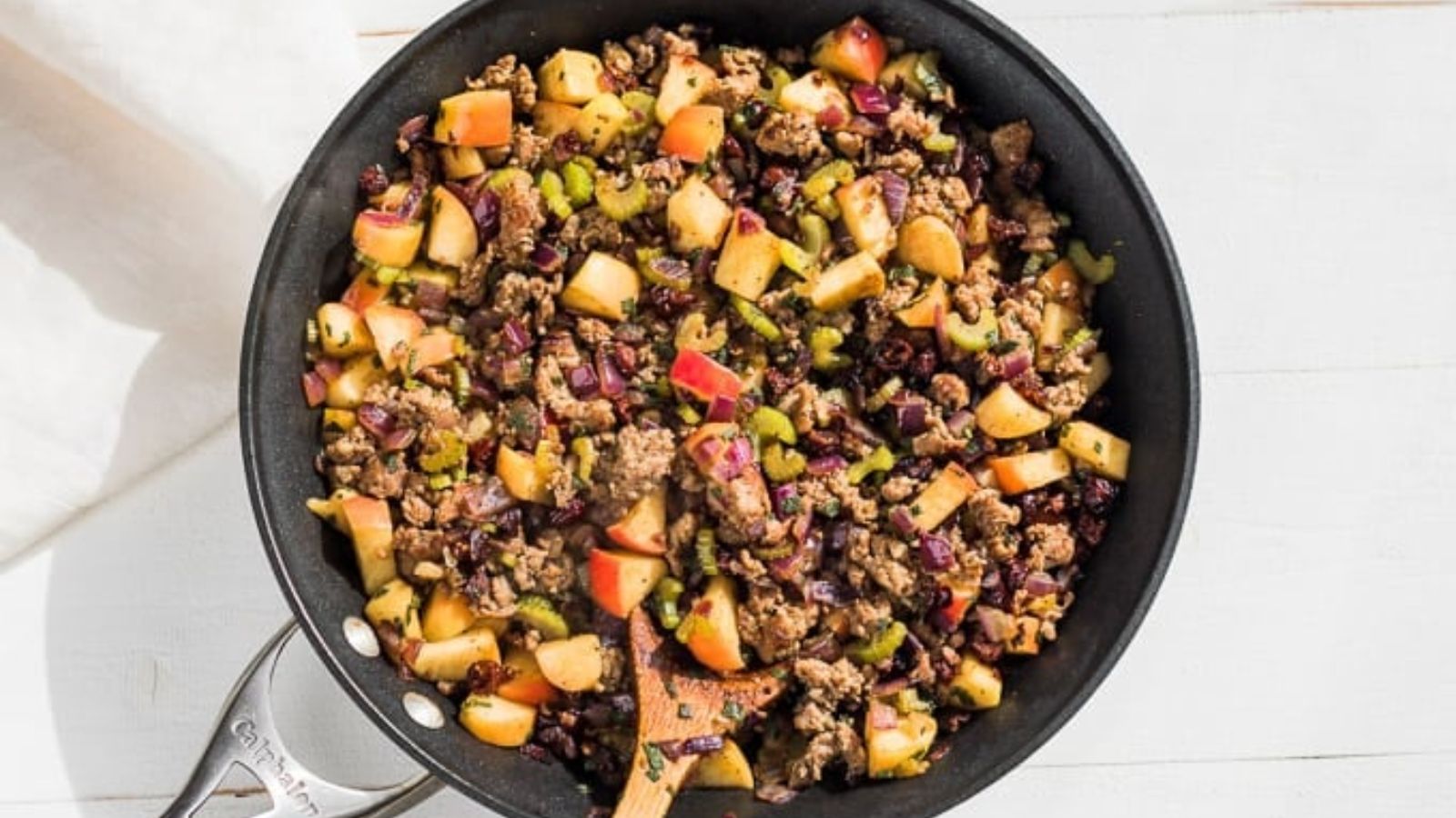 Butternut sausage and apple stuffing in a pan.