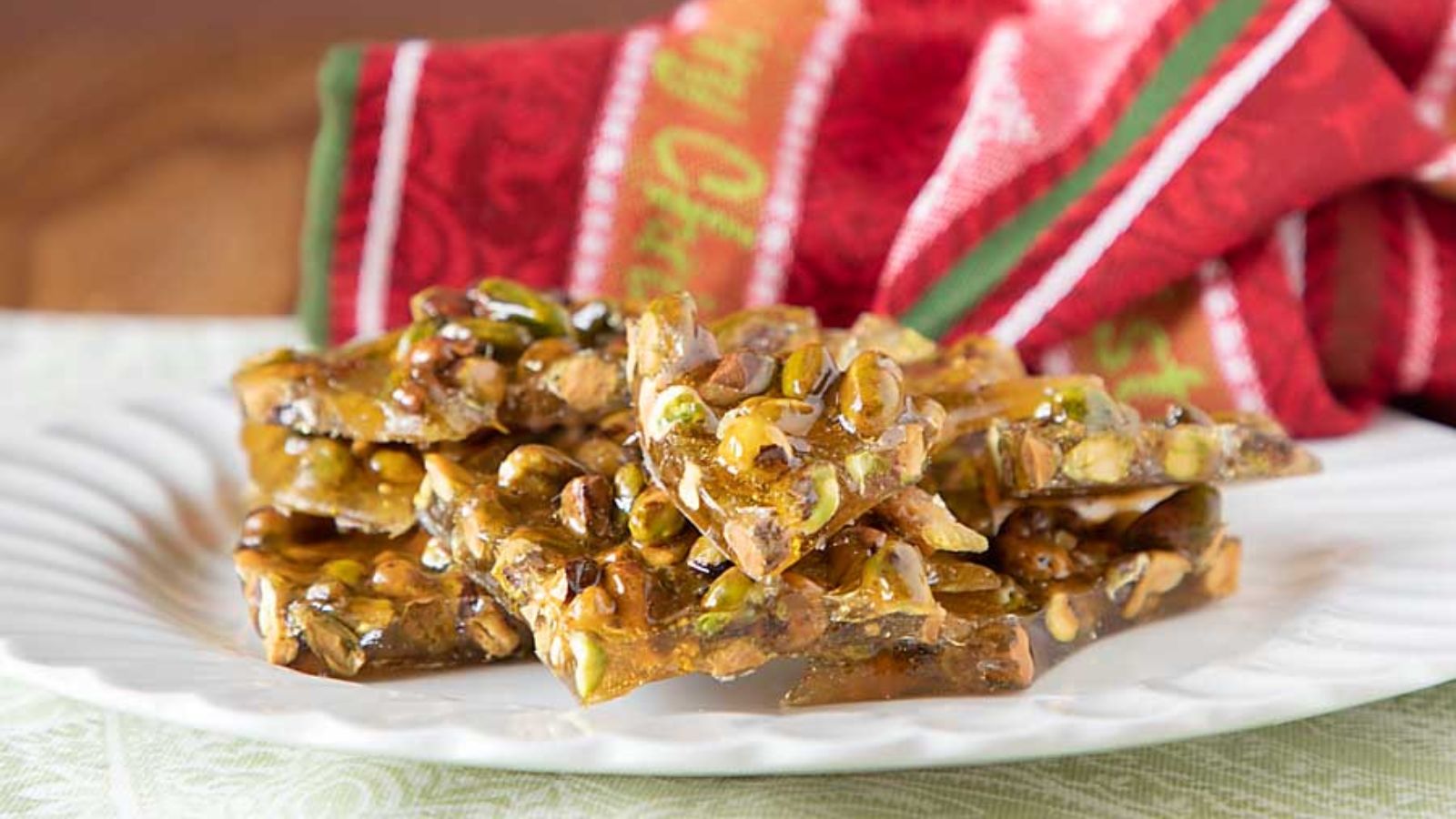 Pistachio brittle on a plate.