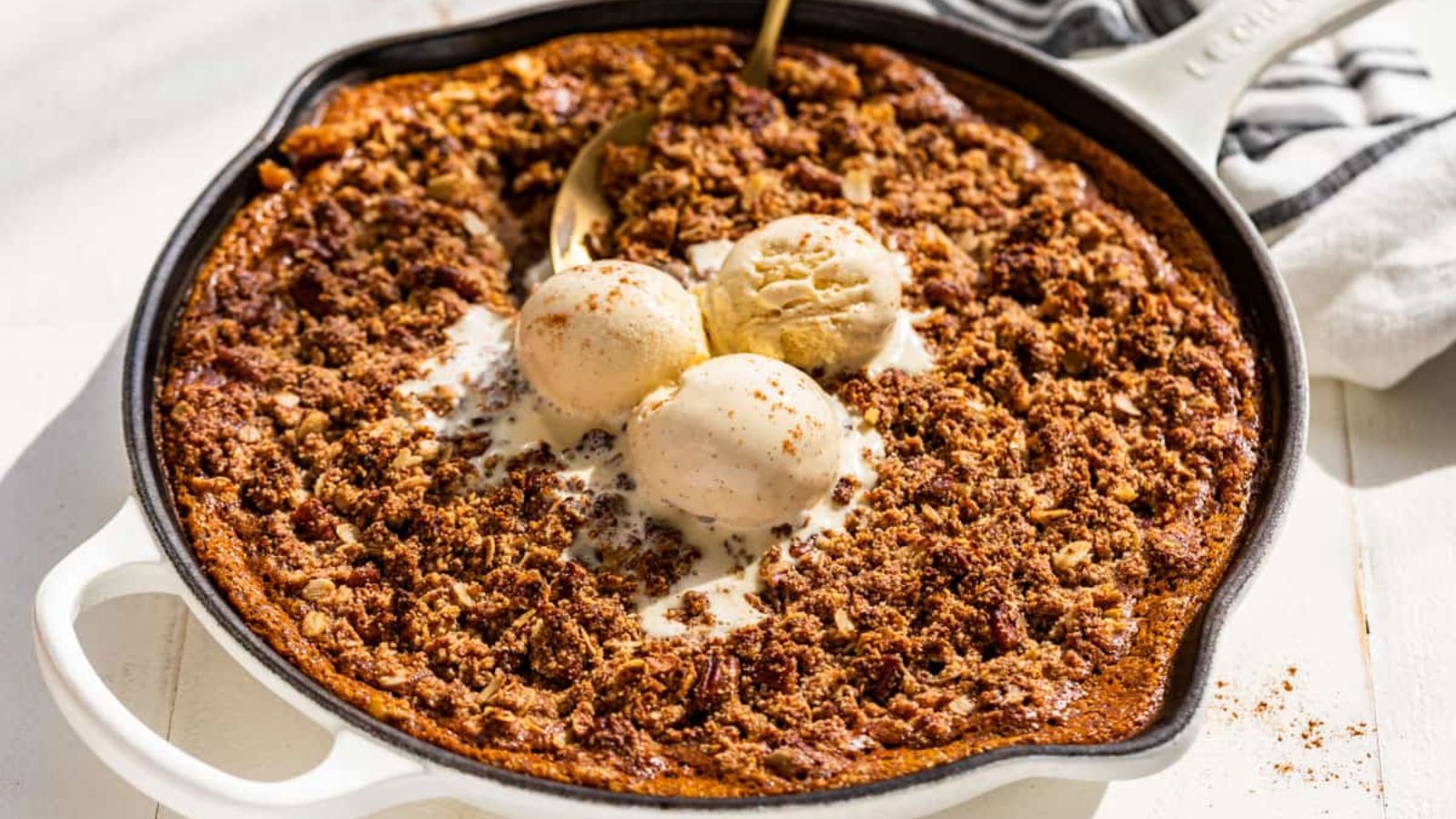 Pumpkin crisp with scoops of ice cream.