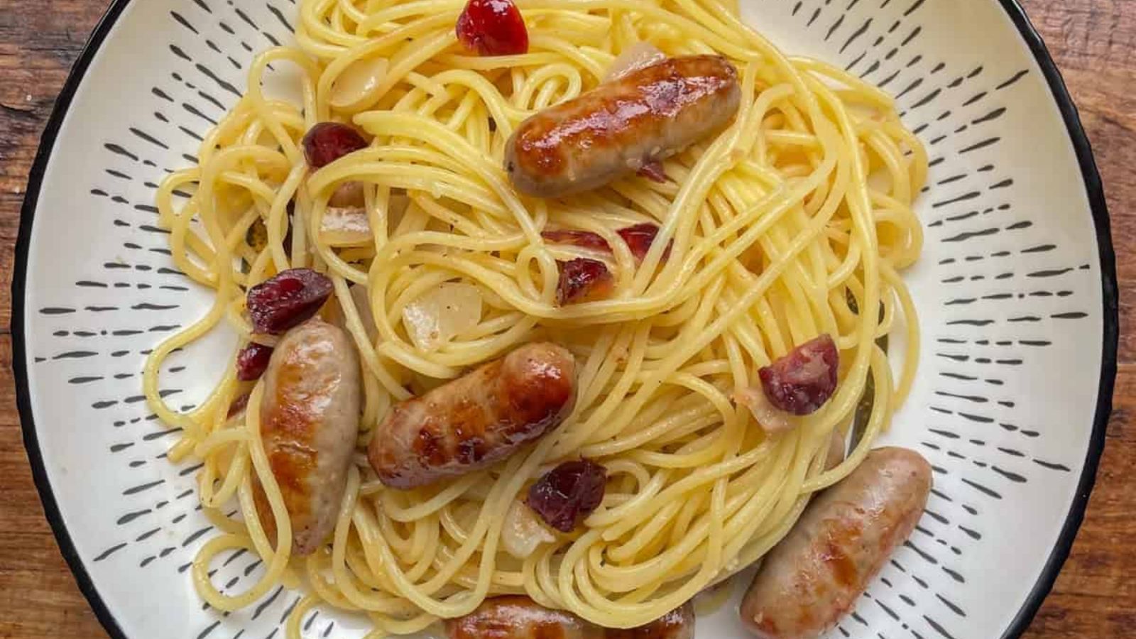 Spaghetti with sausage and cranberries.