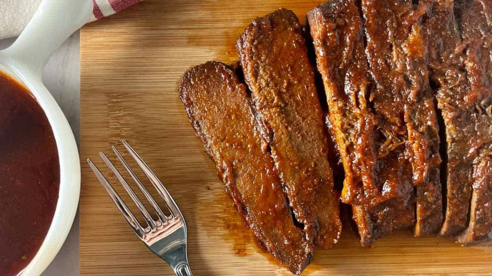 Slices of beef brisket on a plate.