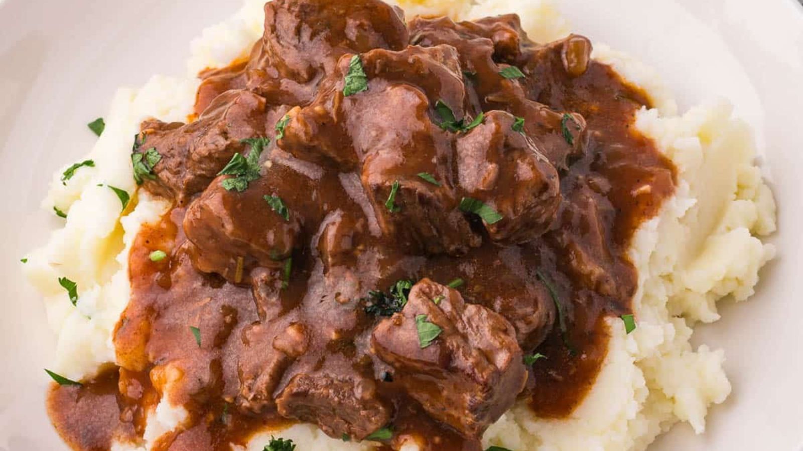 Mashed potato with beef and gravy.