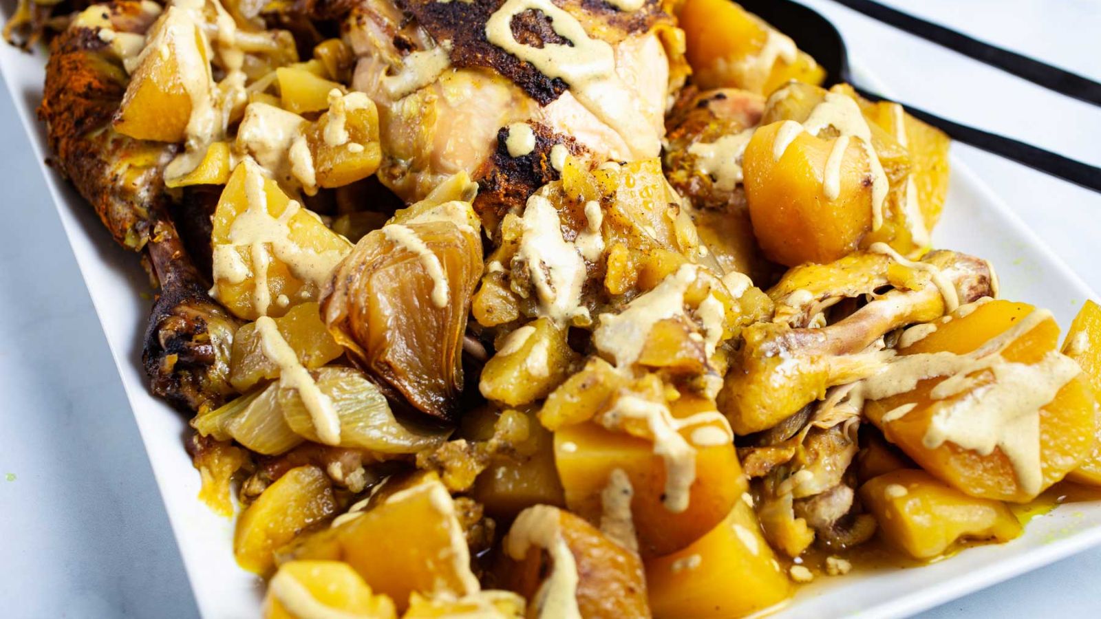 Chicken and potatoes with gravy.