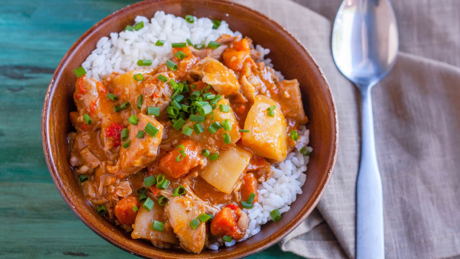 Chicken curry with rice in a bowl.