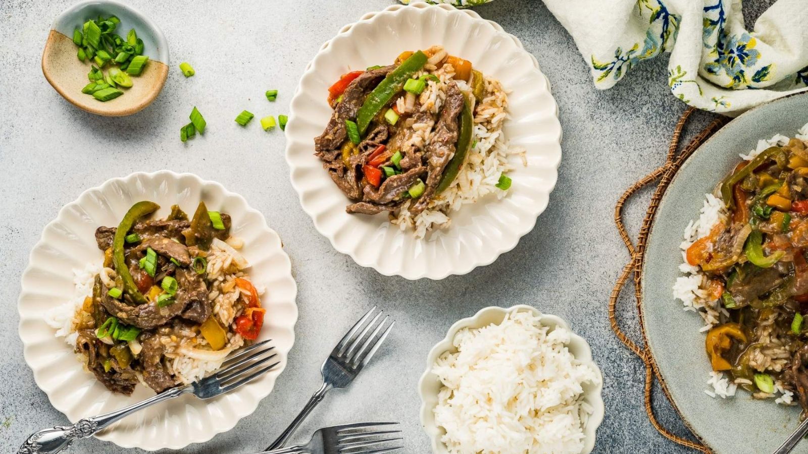 Two plates of pepper steak.
