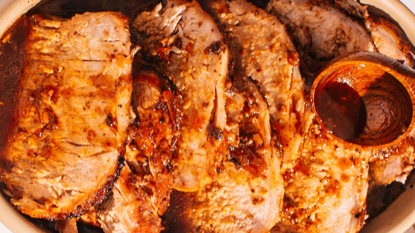 Pork loin slices with sauce.