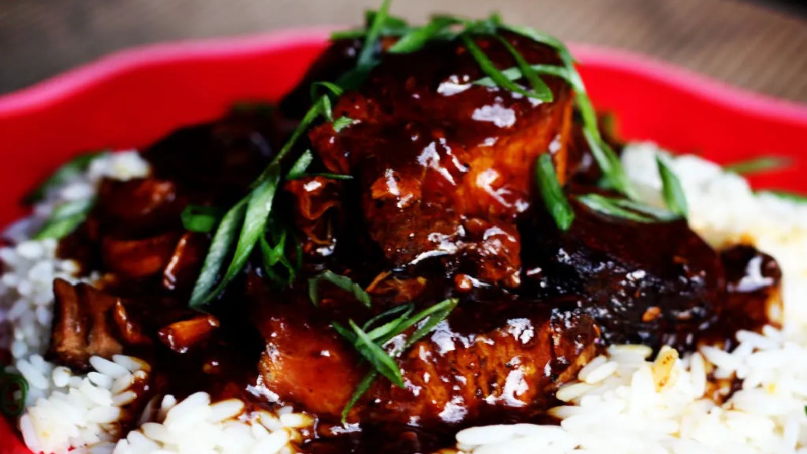 Pork chops with syrup and garnish.