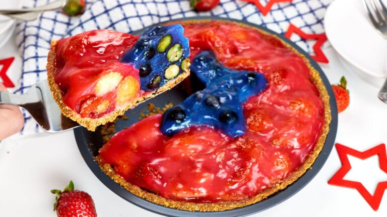 Strawberry blueberry pie with slice.