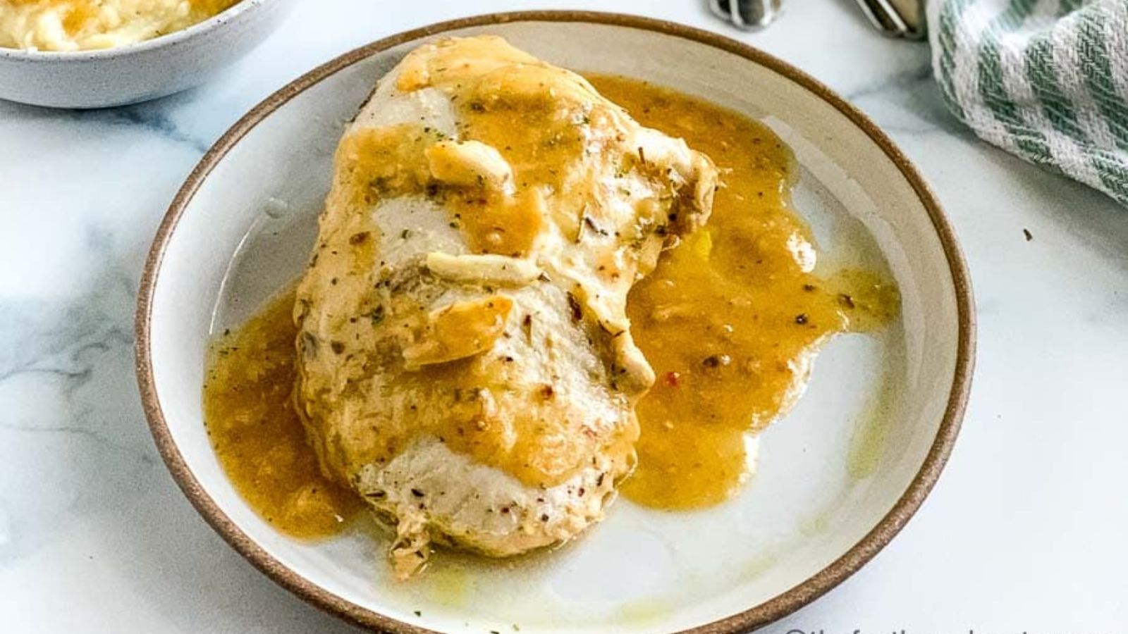 Sliced turkey with sauce.