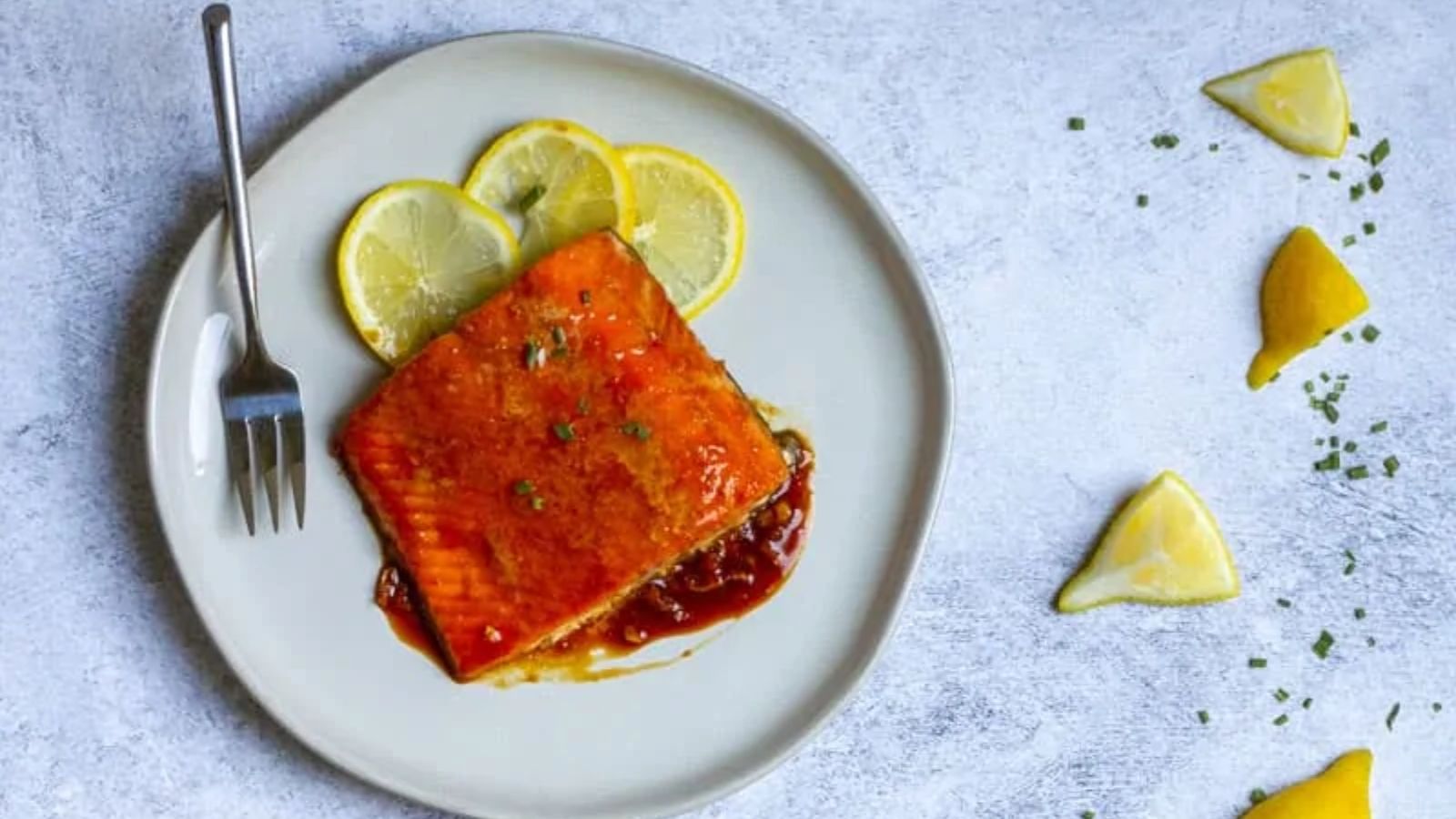 Glazed salmon on a plate.