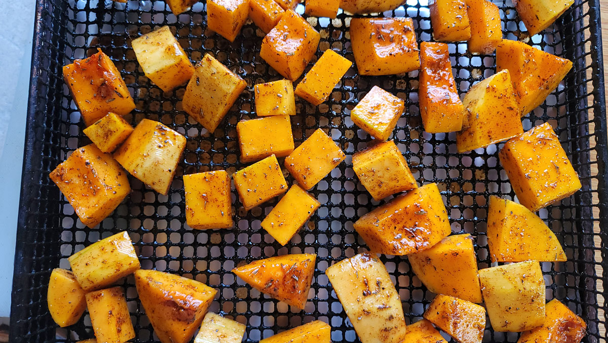 Cubes arranged on the air fryer basker.