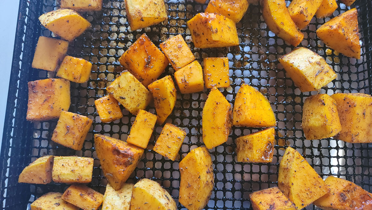 Cubes of squashed with a bit a caramelization after roasting.