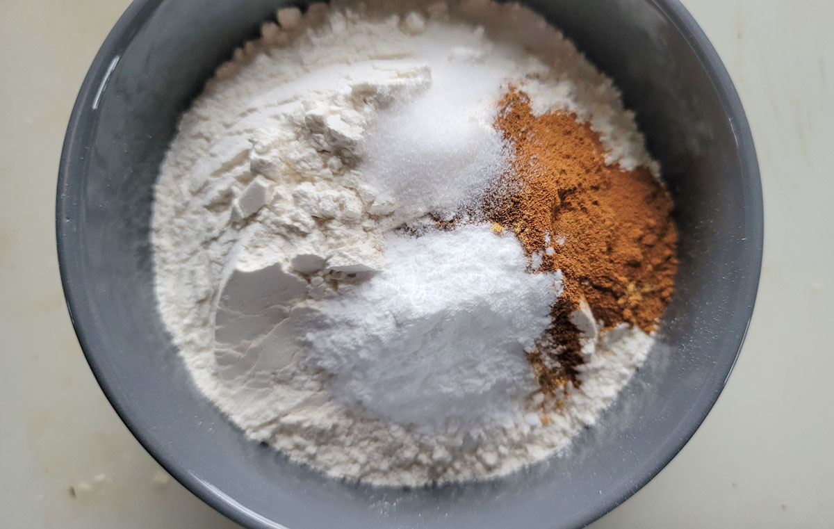 Dry ingredients added to another bowl.