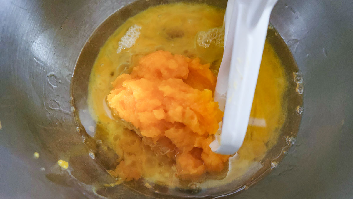 Mashed squash added to the mixing bowl.