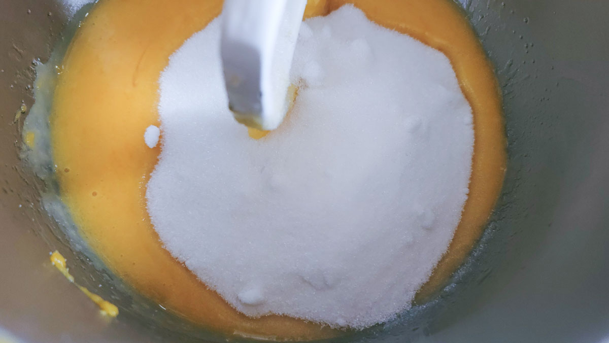 Sugar added to the wet ingredients in the mixing bowl.