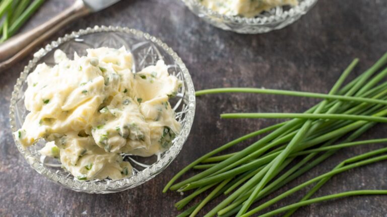 2 bowls of butter with fresh chives on the side.