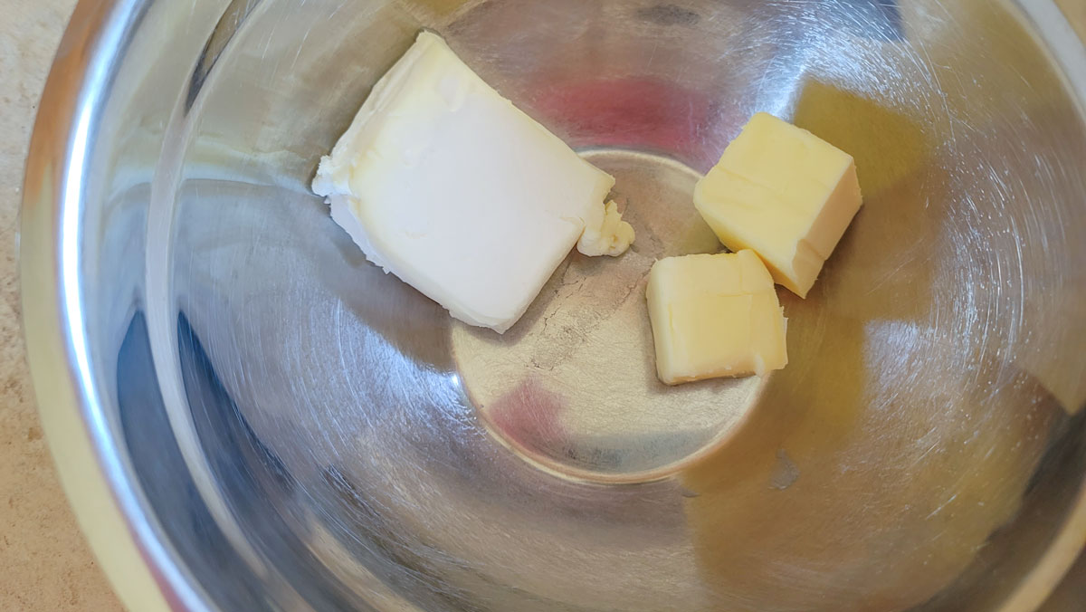 Butter and cream cheese in a medium bowl.