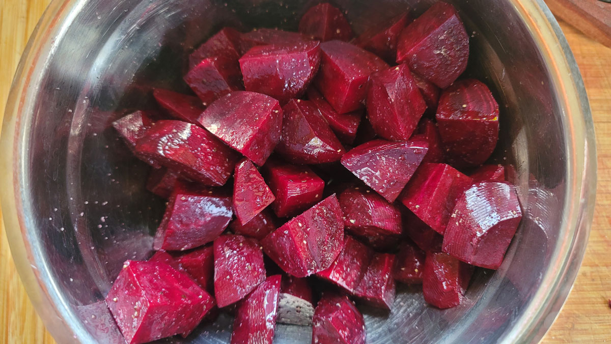 Beets mixed with seasoning and oil.
