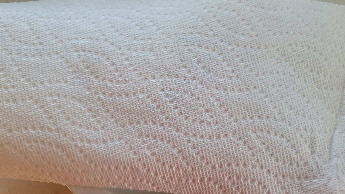 Paper towel covered piece of quiche.