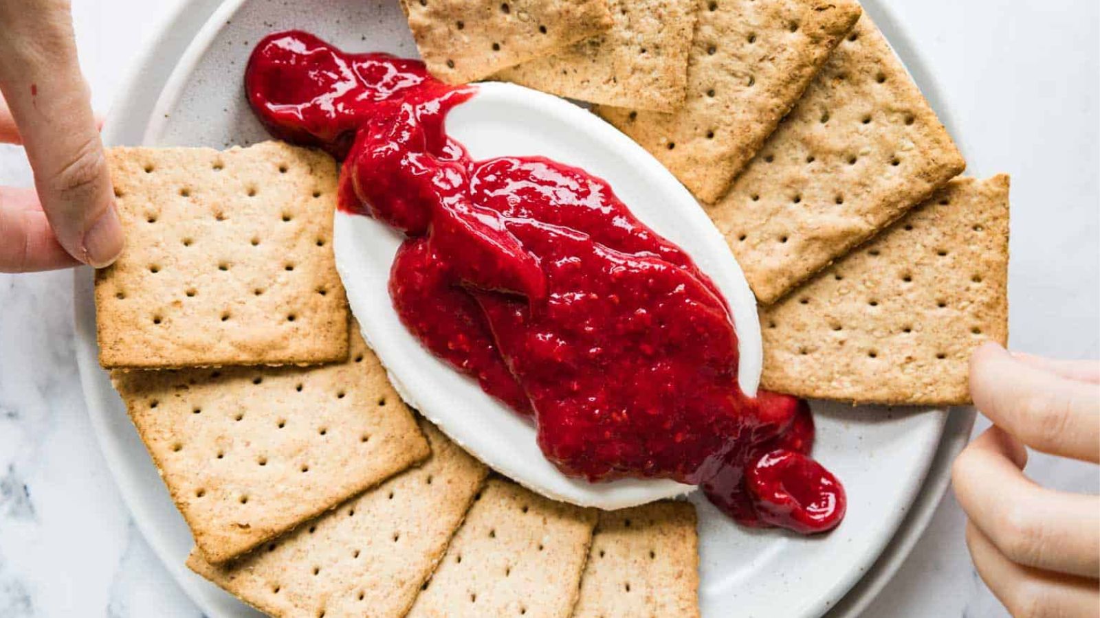 Cream cheese dip with raspberry sauce.