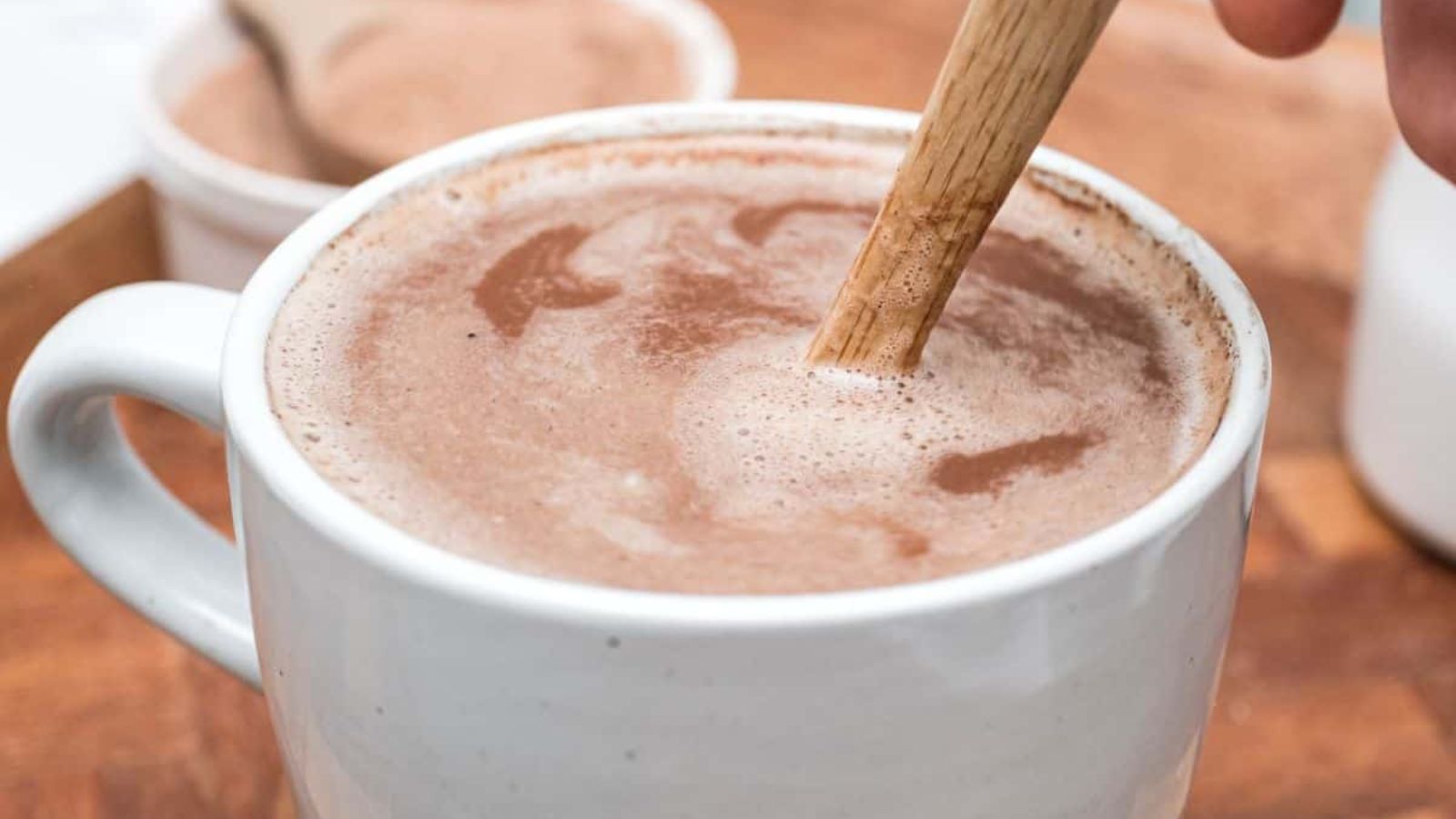 Stirring hot chocolate.
