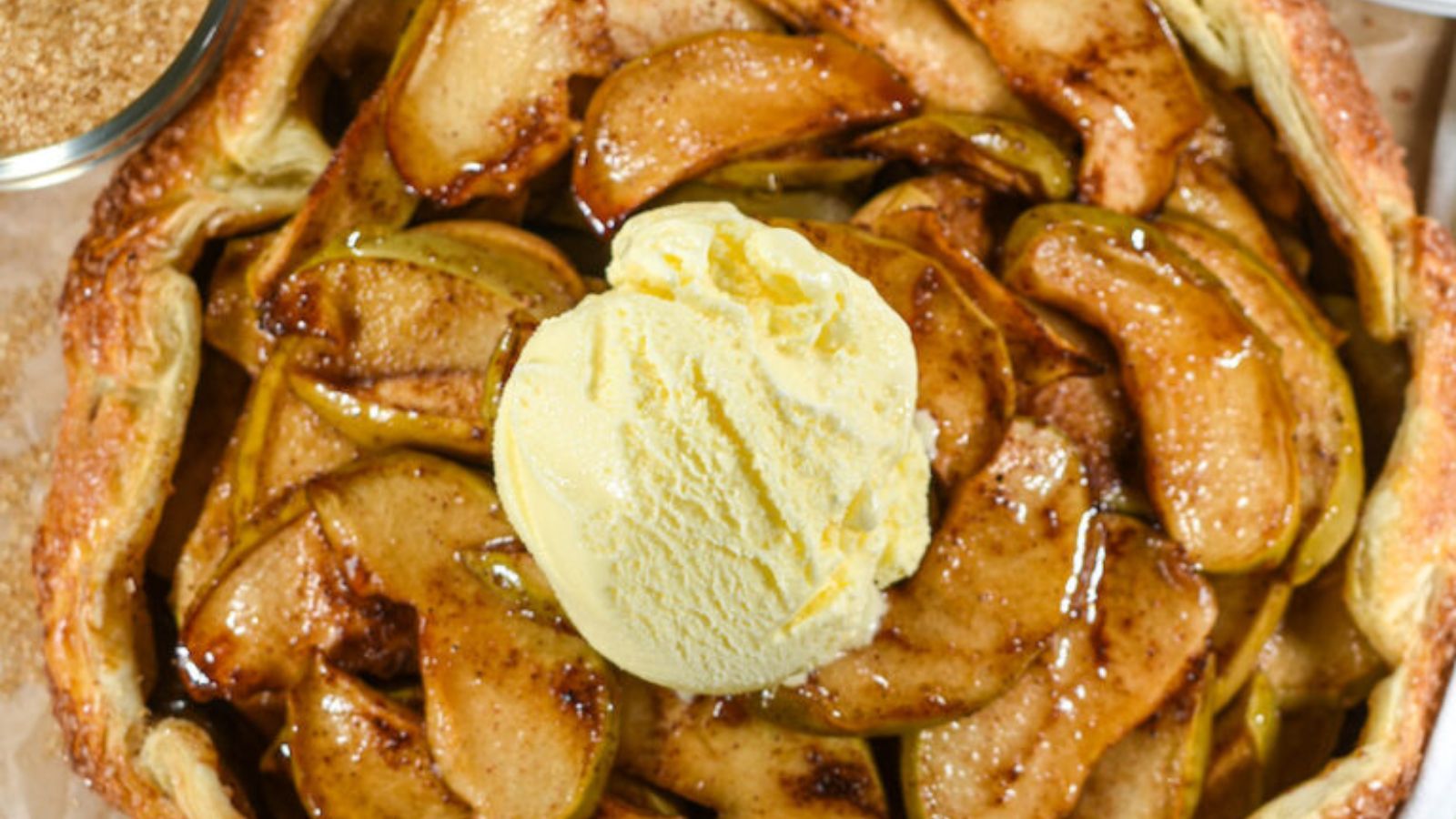 Apple galette with scoop of ice cream.