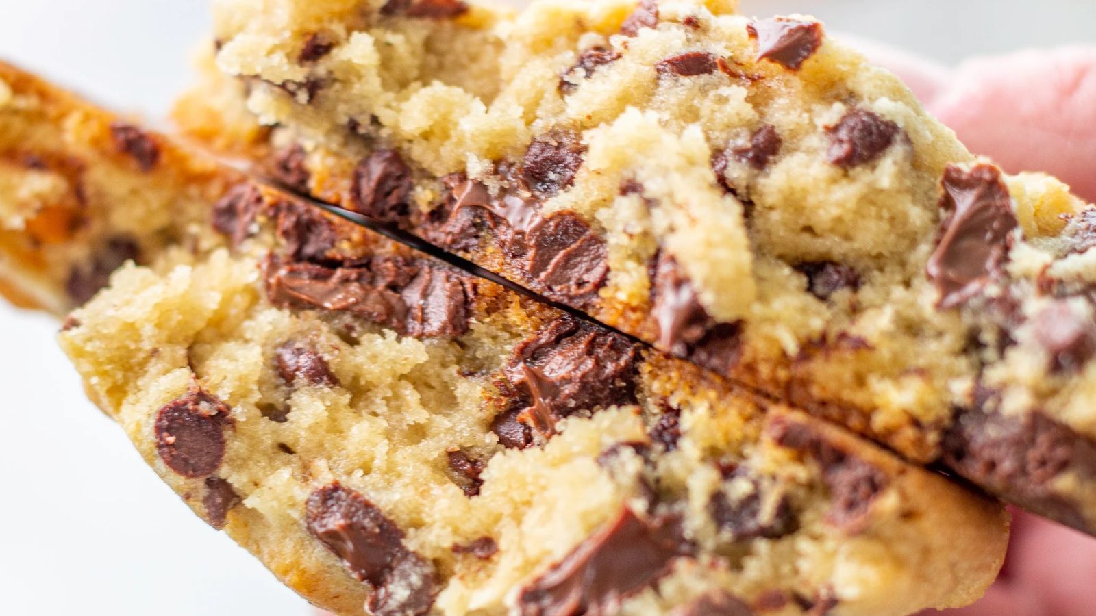 Chocolate chip cookies cut in half.