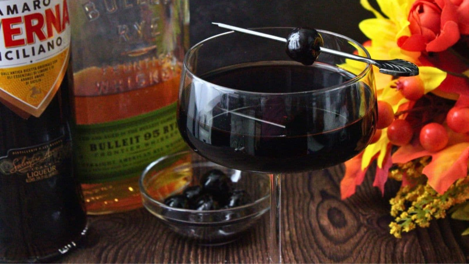 Black cocktail in a glass.