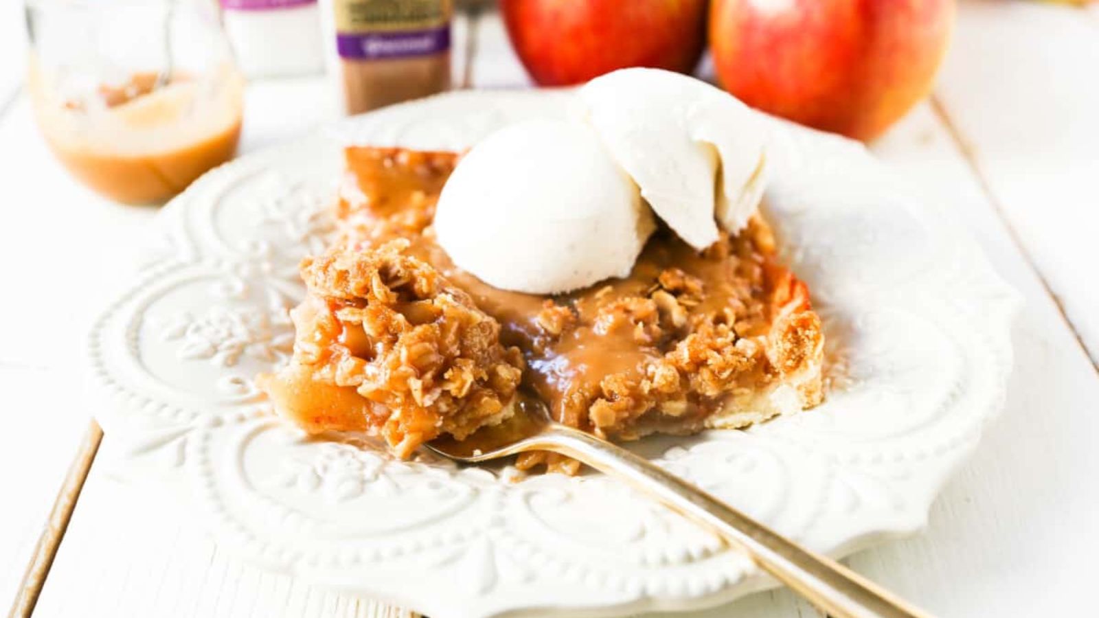 Apple slab pie with caramel and scoops of ice cream.