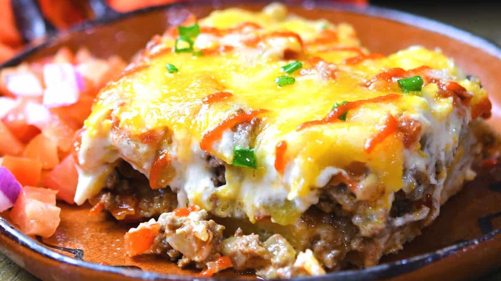A slice of casserole on a plate.