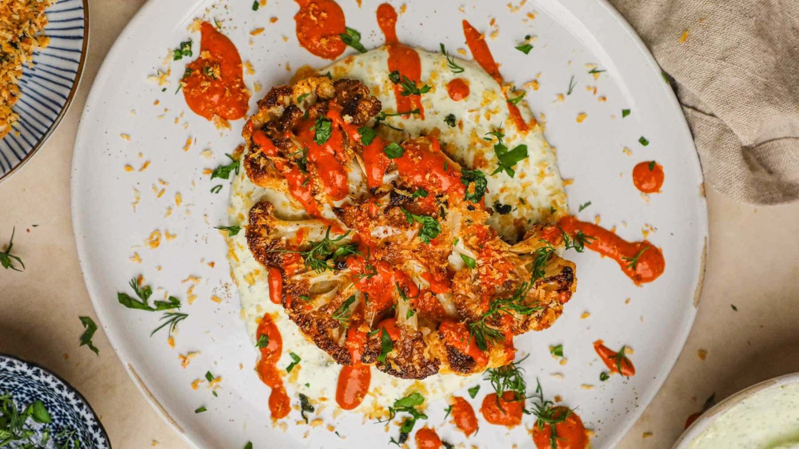 Cauliflower steaks with sauce.