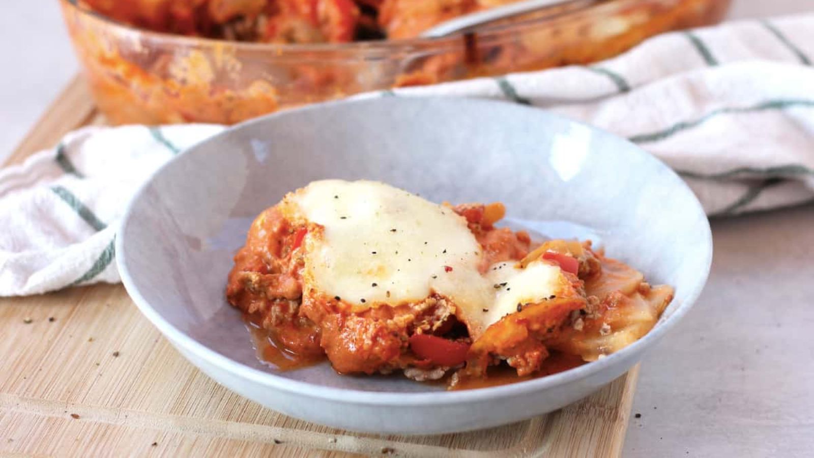Ground beef and vegetable potato bake on a plate.