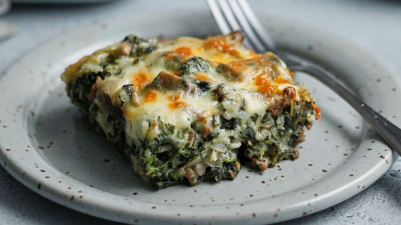 Spinach and beef casserole on a plate.