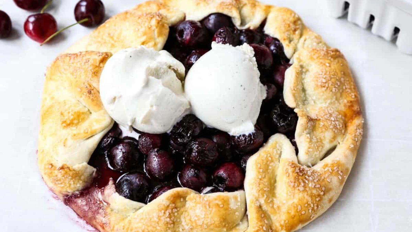 Cherry galette with two scoops of ice cream. 