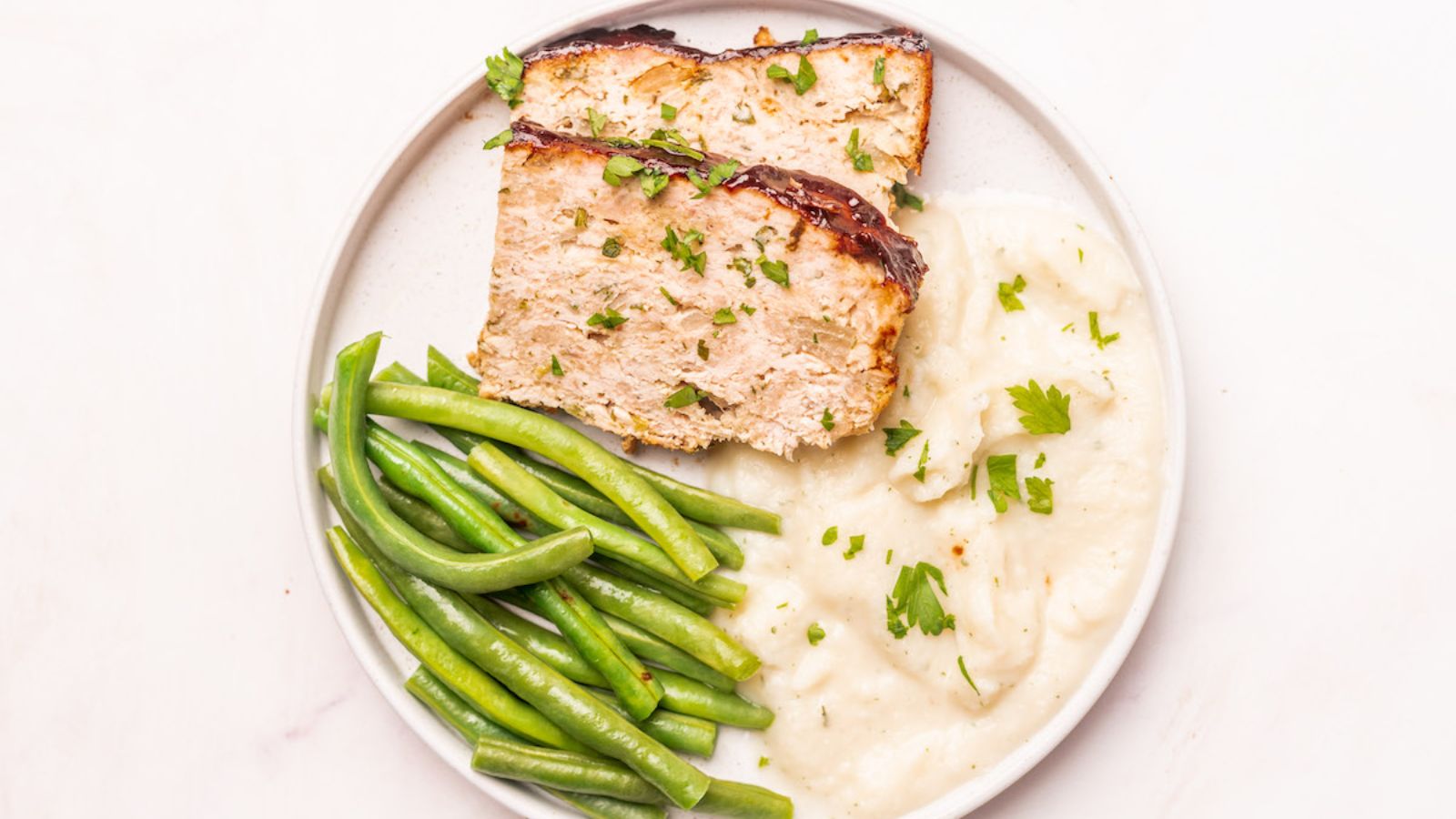 Chicken meatloaf with rice and beans.