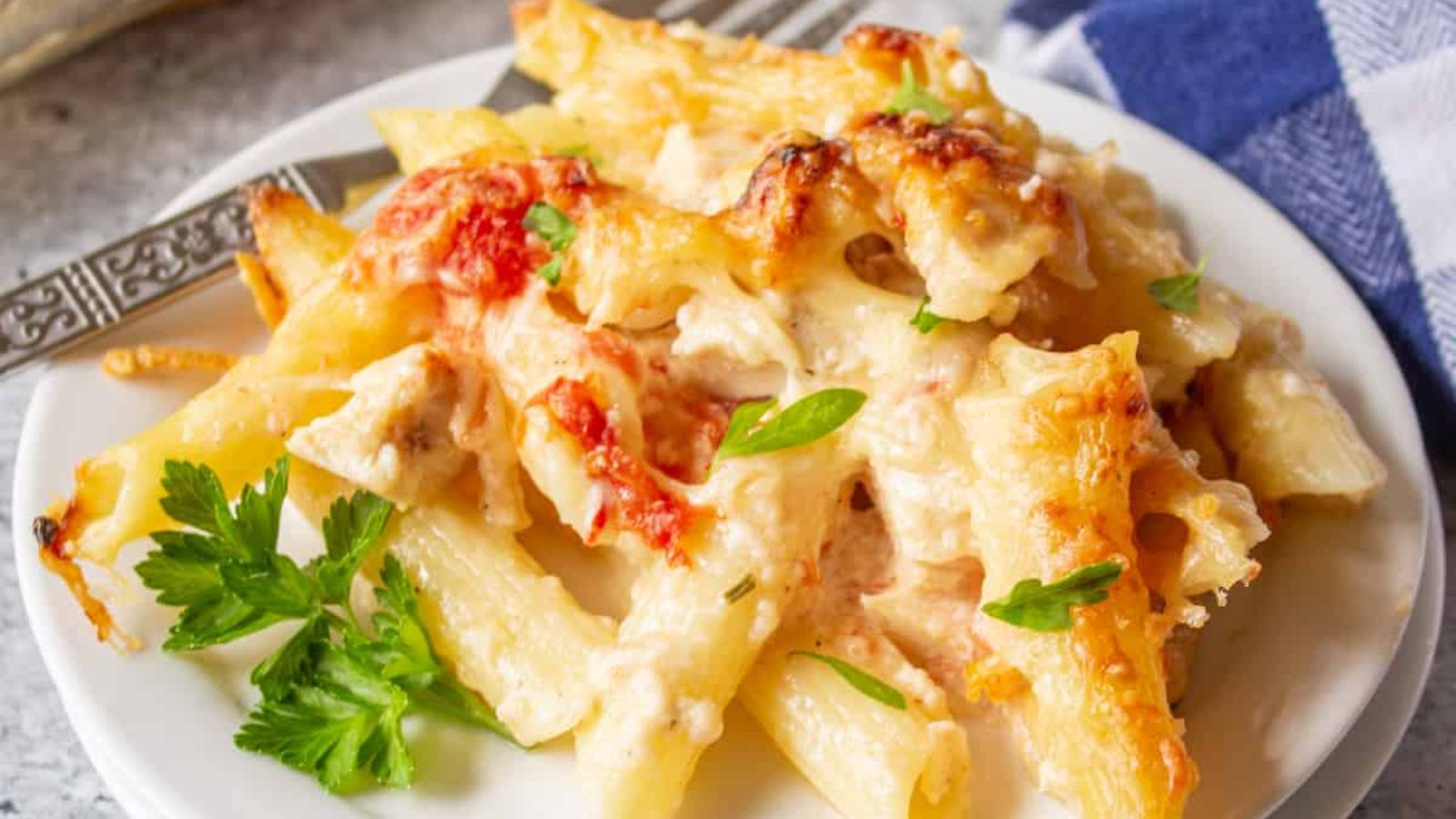 Chicken and pasta bake on a plate.