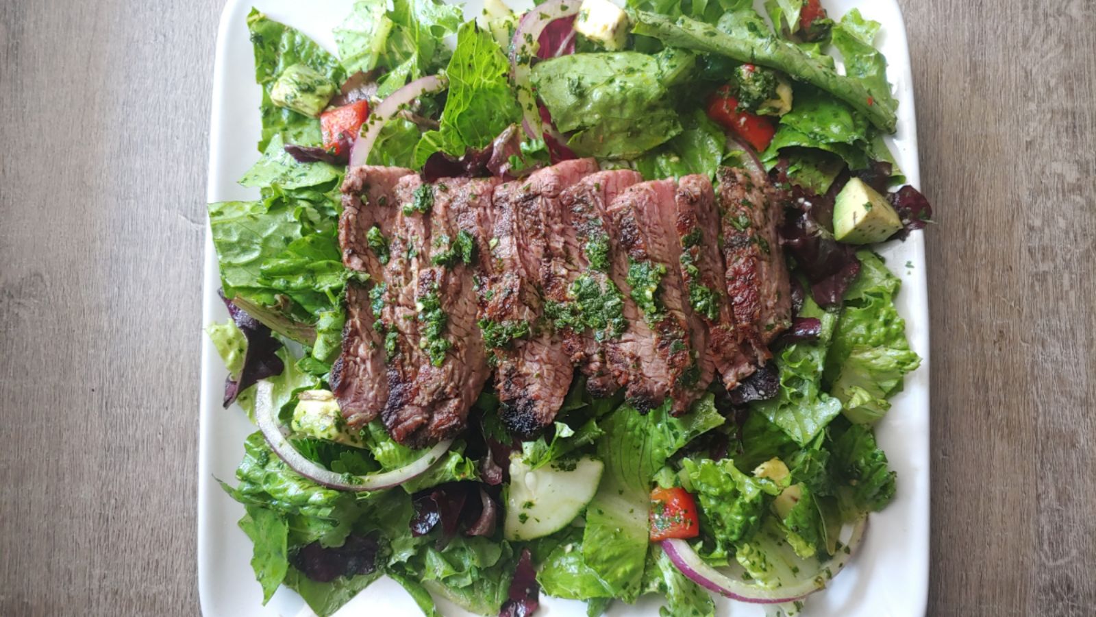 Chimichurri salad with steak.