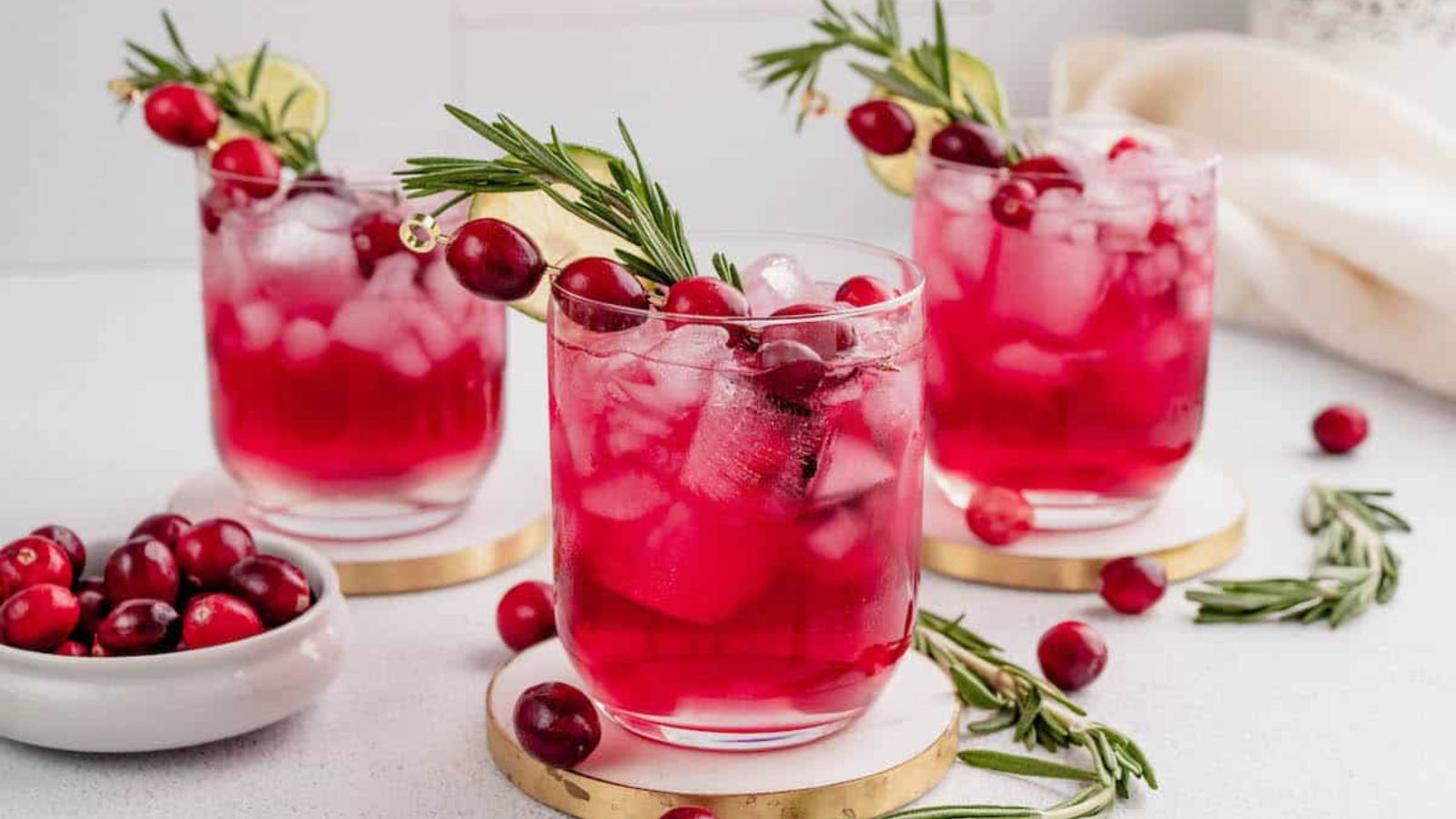 Three glasses of cranberry cocktail.