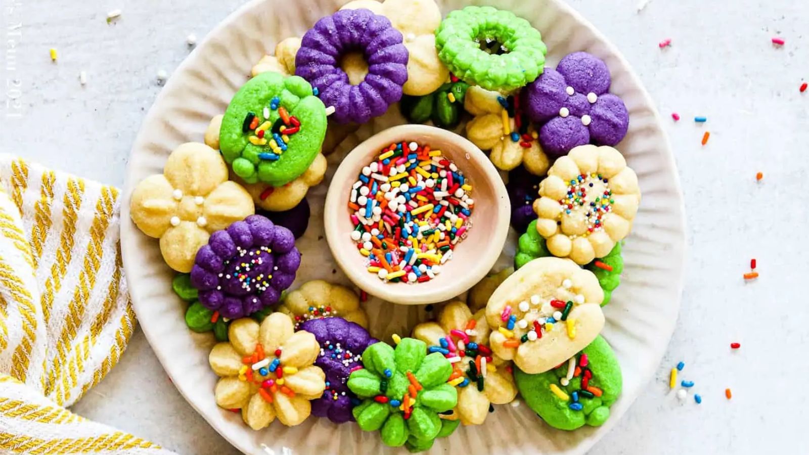 Different colors of cookies with sprinkles.
