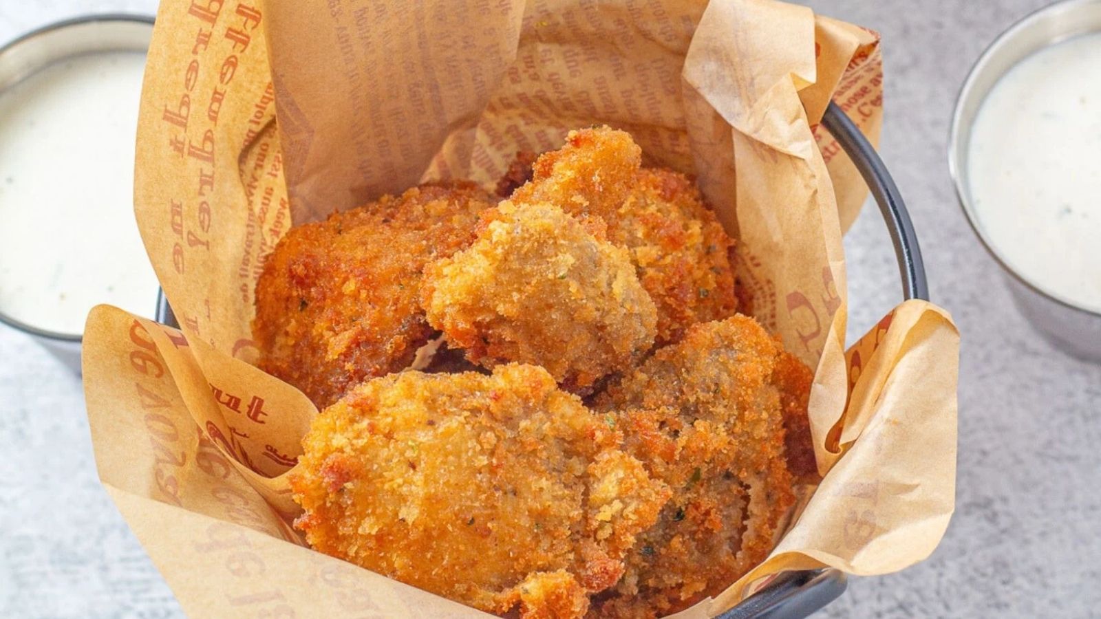 Fried mushrooms in brown paper.