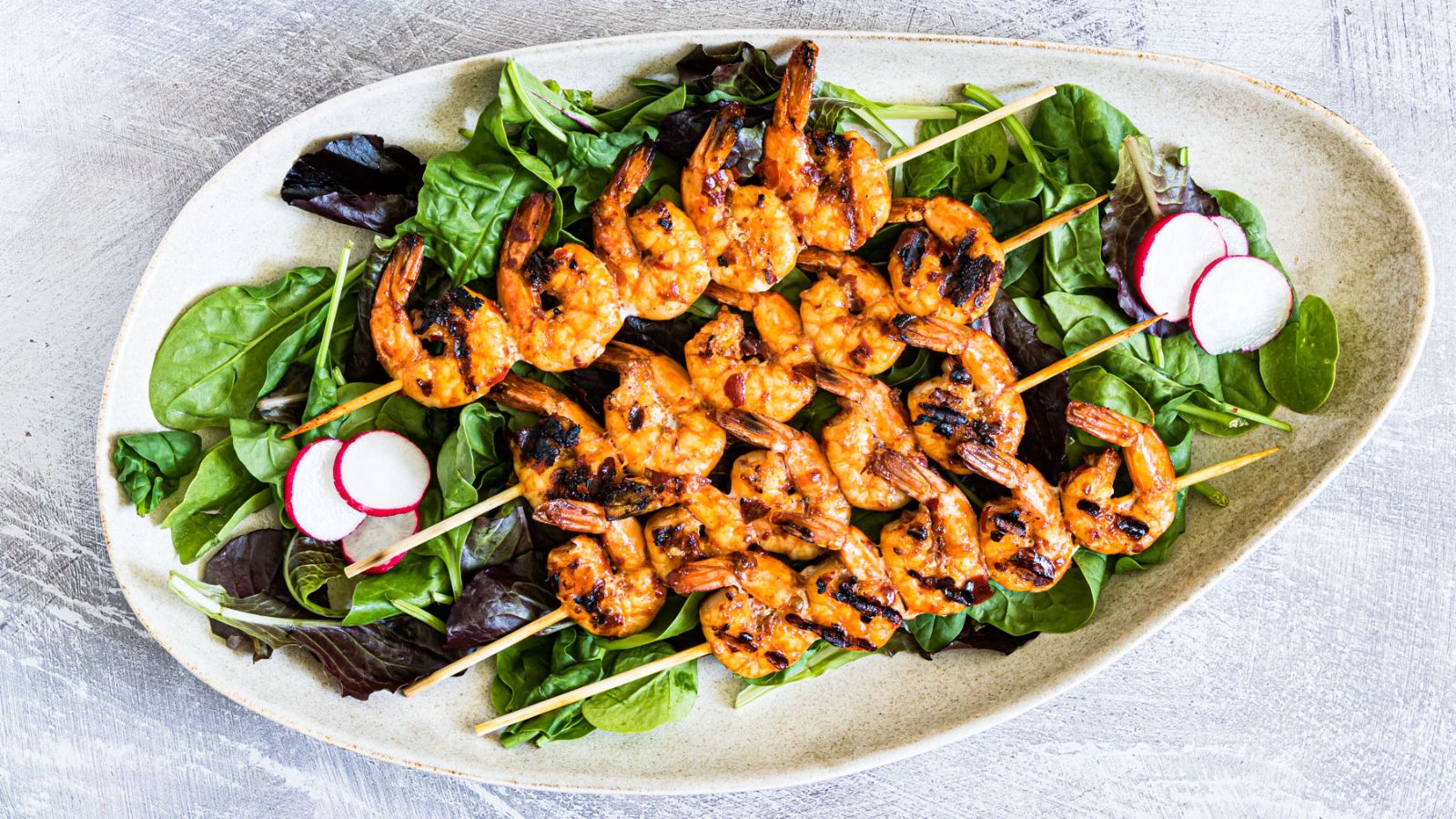 Shrimp skewers on a plate.